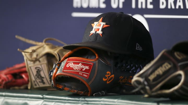 Aug 20, 2022; Atlanta, Georgia, USA; A detailed view of the hat and glove of Houston Astros right fielder Kyle Tucker (not pictured) against the Atlanta Braves in the eleventh inning at Truist Park. Aug 20, 2022; Atlanta, Georgia, USA; A detailed view of the hat and glove of Houston Astros right fielder Kyle Tucker (not pictured) against the Atlanta Braves in the eleventh inning at Truist Park.