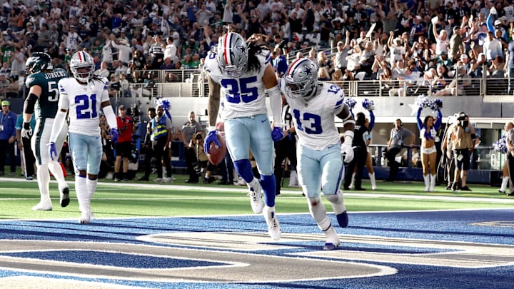 Dallas Cowboys linebacker Marist Liufau and linebacker DeMarvion Overshown react to recovering a fumble in the second quarter against the Philadelphia Eagles at AT&T Stadium. 