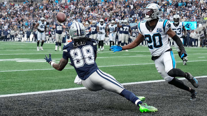 Dallas Cowboys wide receiver CeeDee Lamb (88) scores a touchdown as Carolina Panthers safety Jordan Fuller (20) defends in the second quarter at Bank of America Stadium.