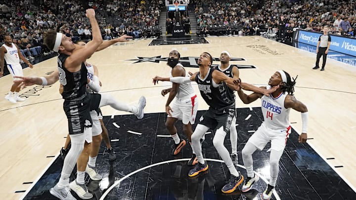 Nov 22, 2023; San Antonio, Texas, USA; San Antonio Spurs forward Victor Wembanyama (1) boxes out Los Angeles Clippers guard James Harden (1) and forward Terance Mann (14) during the second half at Frost Bank Center. Mandatory Credit: Scott Wachter-Imagn Images