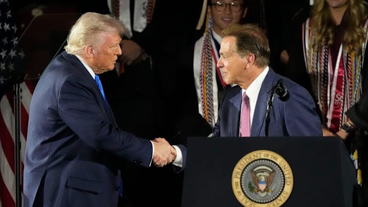 May 1, 2025; Tuscaloosa, AL, USA; President Donald Trump shakes hands with legendary Alabama football coach Nick Saban before delivering a special commencement address to University of Alabama graduates at Coleman Coliseum. Graduation occurs over the weekend. Mandatory Credit: Gary Cosby Jr.-Tuscaloosa News May 1, 2025; Tuscaloosa, AL, USA; President Donald Trump shakes hands with legendary Alabama football coach Nick Saban before delivering a special commencement address to University of Alabama graduates at Coleman Coliseum. Graduation occurs over the weekend. Mandatory Credit: Gary Cosby Jr.-Tuscaloosa News