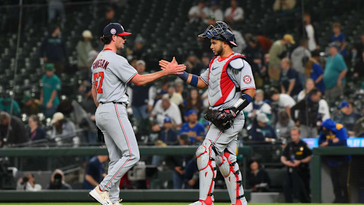 May 29, 2025; Seattle, Washington, USA; Washington Nationals relief pitcher Kyle Finnegan (67) and catcher Keibert Ruiz (20) celebrate defeating the Seattle Mariners at T-Mobile Park. Mandatory Credit: Steven Bisig-Imagn Images