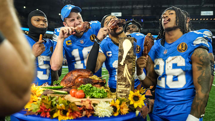 Lions quarterback Jared Goff (16), defensive tackle DJ Reader (98), wide receiver Amon-Ra St. Brown (14), running back Jahmyr Gibbs (26) and linebacker Al-Quadin Muhammad (69) celebrate their win against the Bears with a turkey drumstick Thanksgiving Day in Detroit. Lions quarterback Jared Goff (16), defensive tackle DJ Reader (98), wide receiver Amon-Ra St. Brown (14), running back Jahmyr Gibbs (26) and linebacker Al-Quadin Muhammad (69) celebrate their win against the Bears with a turkey drumstick Thanksgiving Day in Detroit.