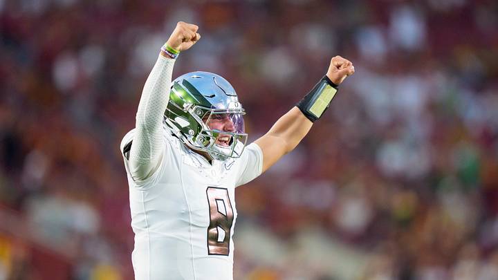 Oregon quarterback Dylan Raiola celebrates a touchdown by Oregon running back Dierre Hill Jr. as the Oregon Ducks face the USC Trojans on Sept. 26, 2026, at Los Angeles Memorial Coliseum in Los Angeles, California.