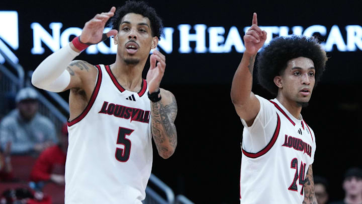 Louisville guard Terrence Edwards Jr. (5) and guard Chucky Hepburn (24) watch a teammate shoot free throws against California during their game at the KFC Yum! Center in Louisville, Ky. on Mar. 5, 2025.
