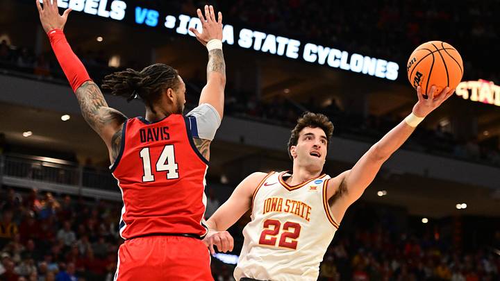 Mar 23, 2025; Milwaukee, WI, USA; Iowa State Cyclones forward Milan Momcilovic (22) shoots against Mississippi Rebels guard Dre Davis (14) during the first half in the second round of the NCAA Tournament at Fiserv Forum. Mandatory Credit: Benny Sieu-Imagn Images Mar 23, 2025; Milwaukee, WI, USA; Iowa State Cyclones forward Milan Momcilovic (22) shoots against Mississippi Rebels guard Dre Davis (14) during the first half in the second round of the NCAA Tournament at Fiserv Forum. Mandatory Credit: Benny Sieu-Imagn Images