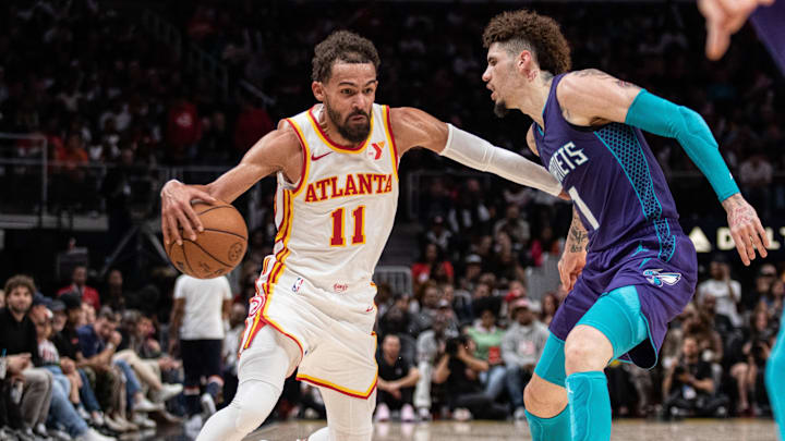 Oct 25, 2024; Atlanta, Georgia, USA; Atlanta Hawks guard Trae Young (11) protects the ball against Charlotte Hornets guard LaMelo Ball (1) during the fourth quarter at State Farm Arena. Mandatory Credit: Jordan Godfree-Imagn Images Oct 25, 2024; Atlanta, Georgia, USA; Atlanta Hawks guard Trae Young (11) protects the ball against Charlotte Hornets guard LaMelo Ball (1) during the fourth quarter at State Farm Arena. Mandatory Credit: Jordan Godfree-Imagn Images