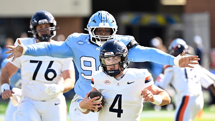 Virginia quarterback Chandler Morris (4) suffers one of six sacks against North Carolina. Virginia quarterback Chandler Morris (4) suffers one of six sacks against North Carolina.