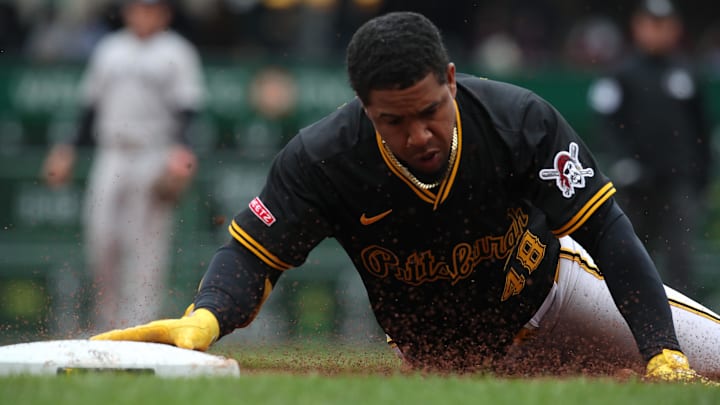 Apr 6, 2025; Pittsburgh, Pennsylvania, USA;  Pittsburgh Pirates first baseman Enmanuel Valdez (48) slides into third base with a triple against the New York Yankees during the fourth inning at PNC Park. Mandatory Credit: Charles LeClaire-Imagn Images