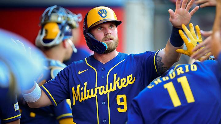 Jul 31, 2026; Anaheim, California, USA; Milwaukee Brewers first baseman Jake Bauers (9) is greeted after scoring a run against the Los Angeles Angels during the second inning at Angel Stadium. Mandatory Credit: Gary A. Vasquez-Imagn Images