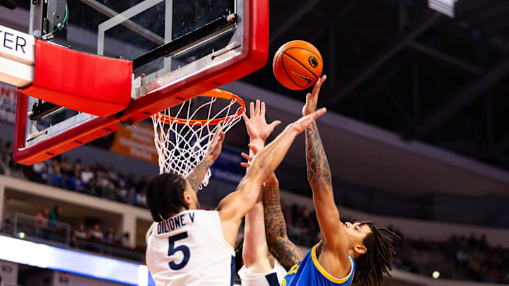 Pittsburgh's Cameron Corhen (2) makes the tough layup over Penn State's Freddie Dilioney (5) inside the Giant Center in Hershey, Pa. on Dec. 21, 2025.