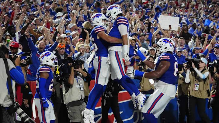 Sep 23, 2024; Orchard Park, New York, USA; Buffalo Bills quarterback Josh Allen (17) celebrates a touchdown with Buffalo Bills tight end Dalton Kincaid (86) during the first half at Highmark Stadium. Mandatory Credit: Gregory Fisher-Imagn Images