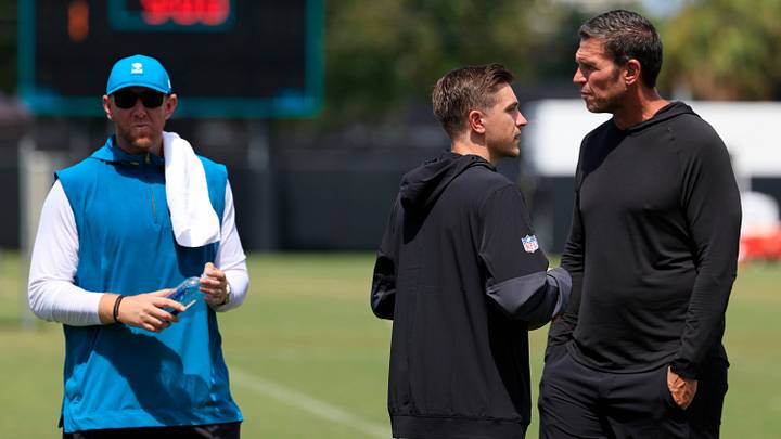 From left, Jacksonville Jaguars head coach Liam Coen, general manager James Gladstone and Tony Boselli, executive vice president of football operations, talk after an NFL training camp session at the Miller Electric Center, Thursday, Aug. 14, 2025 in Jacksonville, Fla.