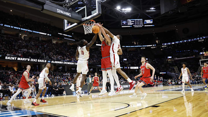 Mar 23, 2025; Cleveland, OH, USA; St. Mary's Gaels center Harry Wessels (1) battles Alabama Crimson Tide center Clifford Omoruyi (11) and forward Mouhamed Dioubate (10) for the ball in the first half during the NCAA Tournament Second Round at Rocket Arena. Mandatory Credit: Rick Osentoski-Imagn Images Mar 23, 2025; Cleveland, OH, USA; St. Mary's Gaels center Harry Wessels (1) battles Alabama Crimson Tide center Clifford Omoruyi (11) and forward Mouhamed Dioubate (10) for the ball in the first half during the NCAA Tournament Second Round at Rocket Arena. Mandatory Credit: Rick Osentoski-Imagn Images