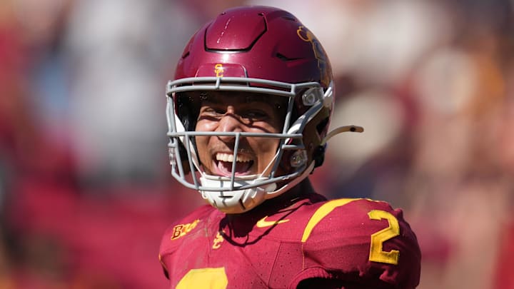 Sep 28, 2024; Los Angeles, California, USA; Southern California Trojans wide receiver Duce Robinson (2) celebrates after scoring on an 8-yard touchdown reception against the Wisconsin Badgersin the second half at United Airlines Field at Los Angeles Memorial Coliseum. Mandatory Credit: Kirby Lee-Imagn Images