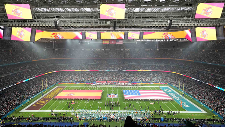 Flags on the field before the 2025 NFL Madrid Game between the Washington Commanders and the Miami Dolphins at Santiago Bernabeu Stadium. Mandatory Credit: Kirby Lee-Imagn Images