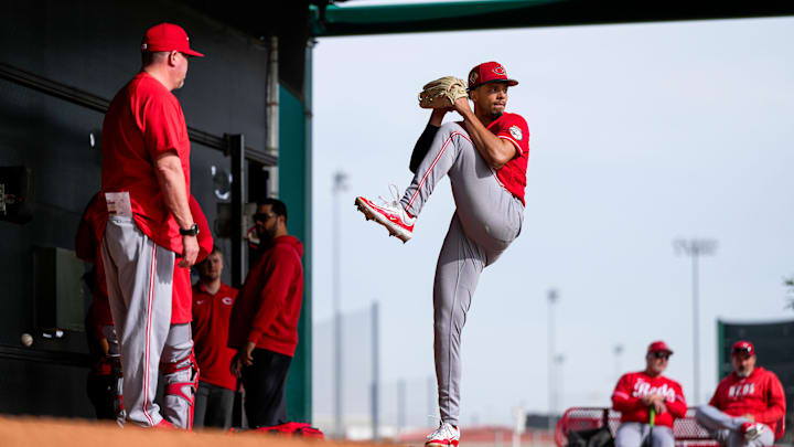 Cincinnati Reds director of pitching Derek Johnson (36) talks with pitcher Chase Burns (26) during a warmup session at the Cincinnati Reds player development complex in Goodyear, Ariz., on Wednesday, Feb. 11, 2026. Cincinnati Reds director of pitching Derek Johnson (36) talks with pitcher Chase Burns (26) during a warmup session at the Cincinnati Reds player development complex in Goodyear, Ariz., on Wednesday, Feb. 11, 2026.