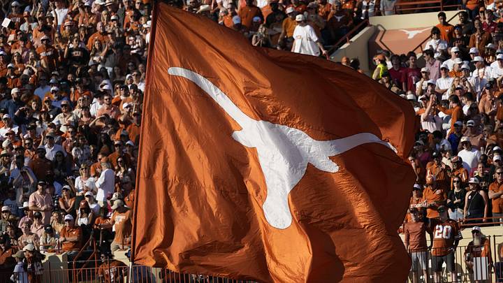 Nov 22, 2025; Austin, Texas, USA; Texas Longhorns flag on the field after a touchdown is scored during the first half against the Arkansas Razorbacks at Darrell K Royal-Texas Memorial Stadium. Mandatory Credit: Scott Wachter-Imagn Images