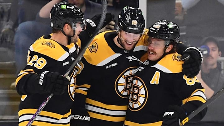 Nov 7, 2024; Boston, Massachusetts, USA;  Boston Bruins center Pavel Zacha (18) is congratulated by defenseman Parker Wotherspoon (29) and right wing David Pastrnak (88) after scoring a goal during the second period against the Calgary Flames at TD Garden. Mandatory Credit: Bob DeChiara-Imagn Images