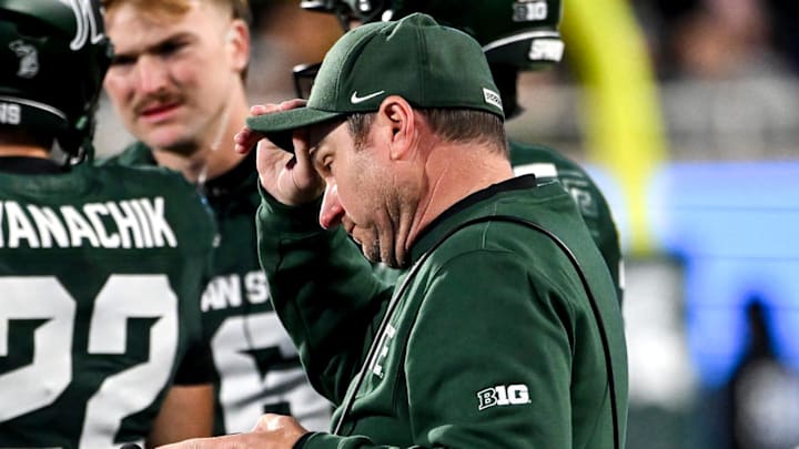 Michigan State's head coach Jonathan Smith approaches the huddle during a timeout in the fourth quarter of the game against Michigan on Saturday, Oct. 25, 2025, at Spartan Stadium in East Lansing.