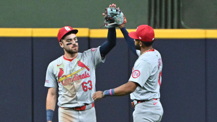 Sep 3, 2024; Milwaukee, Wisconsin, USA;  St. Louis Cardinals outfielder Michael Siani (63) and St. Louis Cardinals outfielder Victor Scott II (11) celebrate a 5-4 win over the Milwaukee Brewers in 12 innings at American Family Field. Mandatory Credit: Michael McLoone-Imagn Images