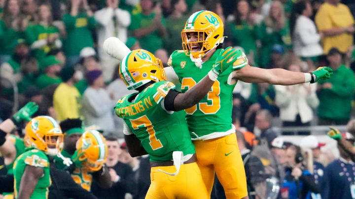 Oregon Ducks defensive back Steve Stephens IV (7) reacts after intercepting a pass against the Liberty Flames in the first half during the Fiesta Bowl at State Farm Stadium in Glendale on Jan. 1, 2024. Oregon Ducks defensive back Steve Stephens IV (7) reacts after intercepting a pass against the Liberty Flames in the first half during the Fiesta Bowl at State Farm Stadium in Glendale on Jan. 1, 2024.