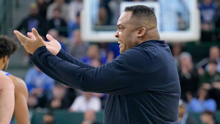 Jan 21, 2024; New Orleans, Louisiana, USA; Tulane Green Wave head coach Ron Hunter pumps up the crowd during the first half against the Memphis Tigers at Avron B. Fogelman Arena in Devlin Fieldhouse. Mandatory Credit: Matthew Hinton-Imagn Images
