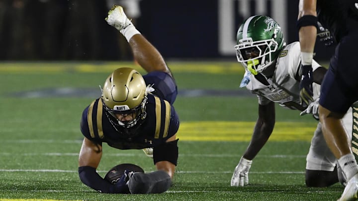Sep 6, 2025; Annapolis, Maryland, USA; Navy Midshipmen safety Giuseppe Sessi (16) recovers UAB Blazers wide receiver Iverson Hook (0)  fumble  during the third quarter at Navy-Marine Corps Memorial Stadium. Mandatory Credit: Tommy Gilligan-Imagn Images