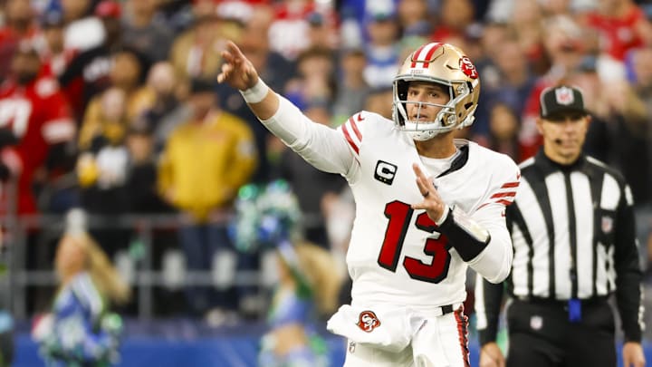 Oct 10, 2024; Seattle, Washington, USA; San Francisco 49ers quarterback Brock Purdy (13) passes against the Seattle Seahawks during the second quarter at Lumen Field. Mandatory Credit: Joe Nicholson-Imagn Images
