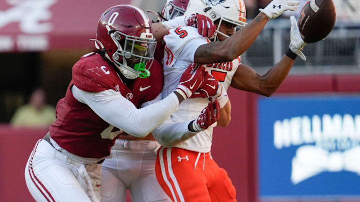 Nov 16, 2024; Tuscaloosa, AL, USA; Alabama Crimson Tide linebacker Deontae Lawson (0) and Alabama Crimson Tide defensive back DeVonta Smith (8) break up a pass intended for Mercer wide receiver Javarius George (5) at Bryant-Denny Stadium. Alabama defeated Mercer 52-7. Mandatory Credit: Gary Cosby Jr.-Tuscaloosa News
