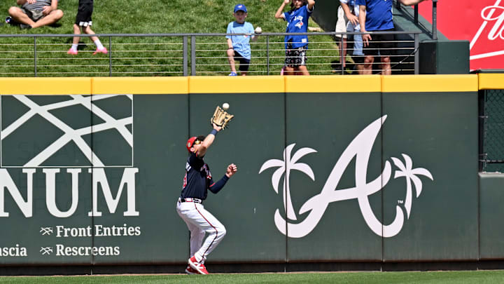 Mar 5, 2026; North Port, Florida, USA; Atlanta Braves left fielder Mike Yastrzemski (18) catches a fly ball in the second inning against the Toronto Blue Jays during spring training at CoolToday Park. Mandatory Credit: Jonathan Dyer-Imagn Images
