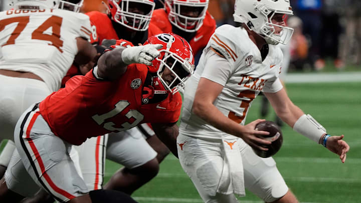 Georgia defensive lineman Mykel Williams (13) goes in for a sack on Texas quarterback Quinn Ewers (3) during the second half of the SEC championship game against Texas in Atlanta, on Saturday, Dec. 7, 2024.