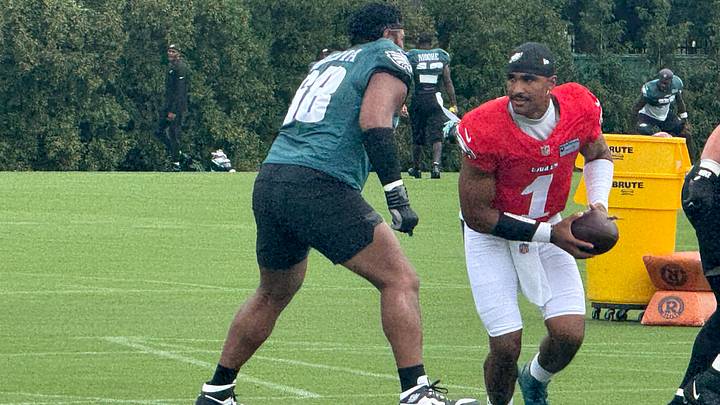 Eagles quarterback Jalen Hurts goes through a drill during the team's 2026 training camp. Eagles quarterback Jalen Hurts goes through a drill during the team's 2026 training camp.