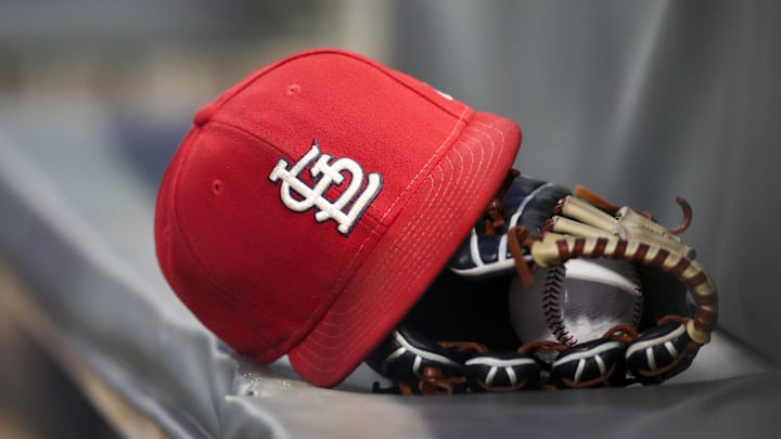 Sep 17, 2018; Atlanta, GA, USA; Detailed view of a St. Louis Cardinals hat and glove in the dugout against the Atlanta Braves in the first inning at SunTrust Park. Mandatory Credit: Brett Davis-Imagn Images
Sep 17, 2018; Atlanta, GA, USA; Detailed view of a St. Louis Cardinals hat and glove in the dugout against the Atlanta Braves in the first inning at SunTrust Park. Mandatory Credit: Brett Davis-Imagn Images