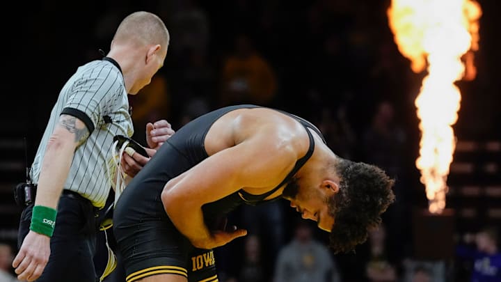 Iowa’s Stephen Buchanan bows to the crowd after defeating Oklahoma State's Luke Surber by major decision in a 197-pound match Sunday, Feb. 23, 2025 at Carver-Hawkeye Arena in Iowa City, Iowa.