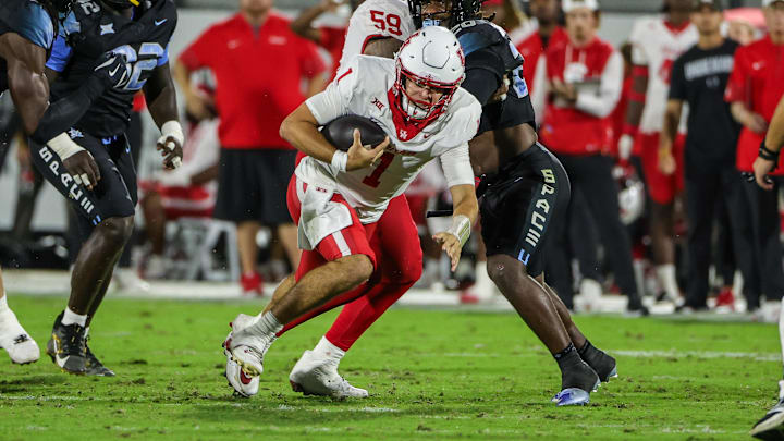 Nov 7, 2025; Orlando, Florida, USA; Houston Cougars quarterback Conner Weigman (1) carries the ball during the first quarter against the UCF Knights at Acrisure Bounce House. 