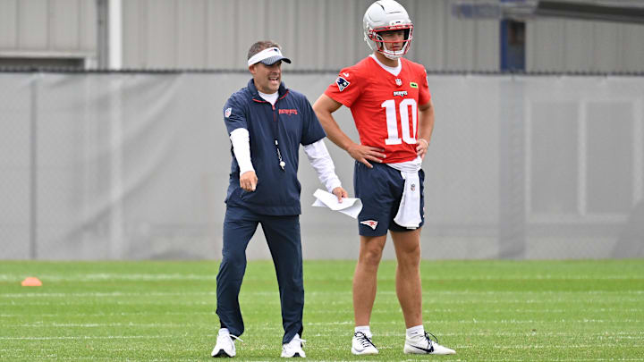 Jun 9, 2025; Foxborough, MA, USA; New England Patriots offensive coordinator Josh McDaniels directs a drill for quarterback Drake Maye (10) during minicamp at Gillette Stadium. Mandatory Credit: Eric Canha-Imagn Images