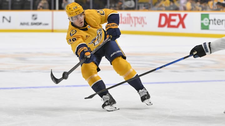 Oct 11, 2025; Nashville, Tennessee, USA; Nashville Predators defenseman Justin Barron (20) passes the puck against the Utah Mammoth during the first period at Bridgestone Arena. Mandatory Credit: Steve Roberts-Imagn Images Oct 11, 2025; Nashville, Tennessee, USA; Nashville Predators defenseman Justin Barron (20) passes the puck against the Utah Mammoth during the first period at Bridgestone Arena. Mandatory Credit: Steve Roberts-Imagn Images