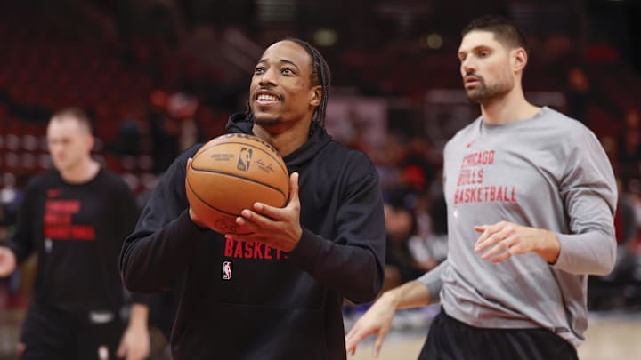 Nov 6, 2023; Chicago, Illinois, USA; Chicago Bulls forward DeMar DeRozan (11) and center Nikola Vucevic (9) warm up before a basketball game against the Utah Jazz at United Center. Mandatory Credit: Kamil Krzaczynski-Imagn Images