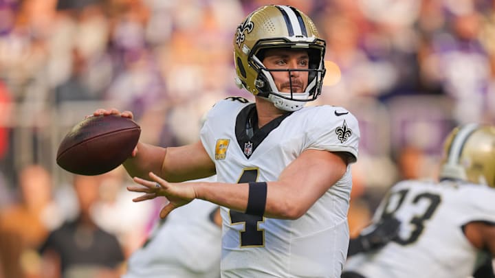 Nov 12, 2023; Minneapolis, Minnesota, USA; New Orleans Saints quarterback Derek Carr (4) passes against the Minnesota Vikings in the first quarter at U.S. Bank Stadium.