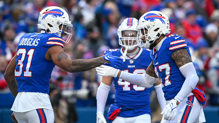 Buffalo Bills cornerback Rasul Douglas and cornerback Christian Benford celebrate a turnover against the New England Patriots with linebacker Terrel Bernard in the first quarter at Highmark Stadium.
