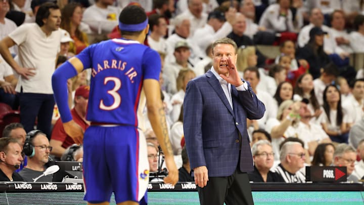 Feb 4, 2023; Ames, Iowa, USA;  Kansas Jayhawks head coach Bill Self talks with guard Dajuan Harris Jr. (3) during a game against the Iowa State Cyclones at James H. Hilton Coliseum. Mandatory Credit: Reese Strickland-Imagn Images