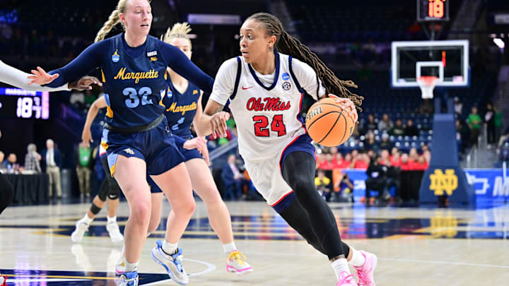 Mar 23, 2024; South Bend, Indiana, USA; Ole Miss Rebels forward Madison Scott (24) drives to the basket as Marquette Golden Eagles forward Liza Karlen (32) defends in the first half at the Purcell Pavilion. Mandatory Credit: Matt Cashore-Imagn Images