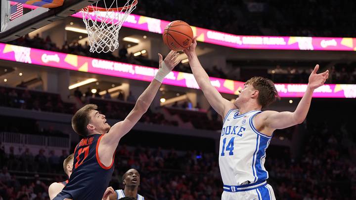 Mar 14, 2026; Charlotte, NC, USA; Virginia Cavaliers center Johann Grünloh (17) and Duke Blue Devils guard Nikolas Khamenia (14) reach for the ball in the first half during the men's ACC Conference Tournament Championship at Spectrum Center. Mandatory Credit: Bob Donnan-Imagn Images Mar 14, 2026; Charlotte, NC, USA; Virginia Cavaliers center Johann Grünloh (17) and Duke Blue Devils guard Nikolas Khamenia (14) reach for the ball in the first half during the men's ACC Conference Tournament Championship at Spectrum Center. Mandatory Credit: Bob Donnan-Imagn Images