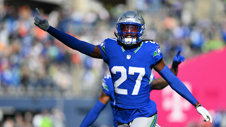 Seattle Seahawks cornerback Riq Woolen celebrates intercepting a pass against the Cleveland Browns.