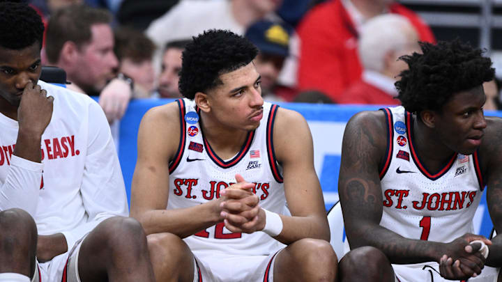 Mar 22, 2025; Providence, RI, USA; St. John's Red Storm guard RJ Luis Jr. (12), guard Kadary Richmond (1) and teammates on the bench during the second half of a second round men’s NCAA Tournament game against the Arkansas Razorbacks at Amica Mutual Pavilion. Mandatory Credit: Brian Fluharty-Imagn Images