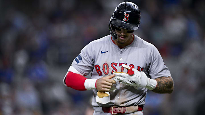 Aug 3, 2024; Arlington, Texas, USA;  Boston Red Sox left fielder Jarren Duran (16) removes his batting gloves after he strikes out to end the inning against the Texas Rangers during the eighth inning at Globe Life Field. Mandatory Credit: Jerome Miron-USA TODAY Sports