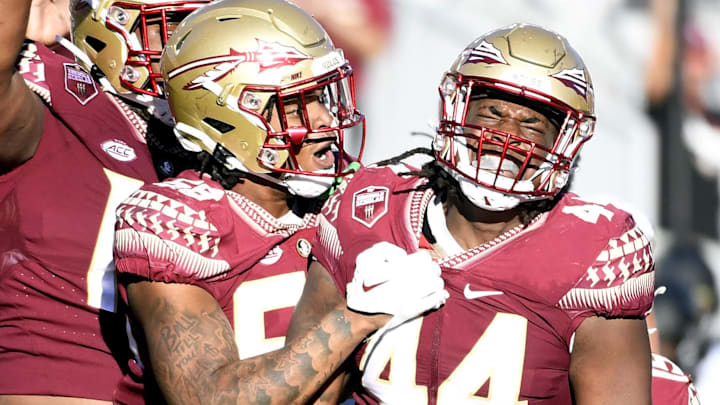 Oct 1, 2022; Tallahassee, Florida, USA; Florida State Seminoles defensive end Patrick Payton (56) celebrates a sack with defensive tackle Joshua Farmer (44) during the second half against the Wake Forest Demon Deacons at Doak S. Campbell Stadium. Mandatory Credit: Melina Myers-Imagn Images Oct 1, 2022; Tallahassee, Florida, USA; Florida State Seminoles defensive end Patrick Payton (56) celebrates a sack with defensive tackle Joshua Farmer (44) during the second half against the Wake Forest Demon Deacons at Doak S. Campbell Stadium. Mandatory Credit: Melina Myers-Imagn Images
