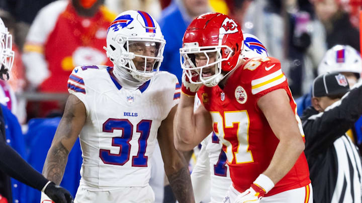 Jan 26, 2025; Kansas City, MO, USA; Kansas City Chiefs tight end Travis Kelce (87) reacts as he talks to Buffalo Bills cornerback Rasul Douglas (31) during the AFC Championship game at GEHA Field at Arrowhead Stadium.