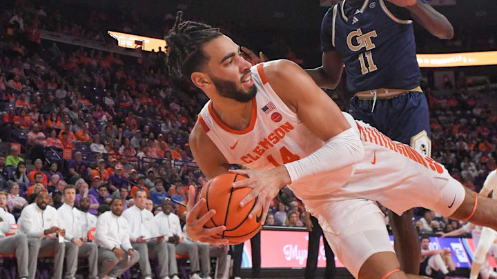 Clemson center Christian Reeves (14) saves a ball near Georgia Tech forward Baye Ndongo (11) during the first half at Littlejohn Coliseum in Clemson, S.C. Tuesday, February 4, 2025. Clemson center Christian Reeves (14) saves a ball near Georgia Tech forward Baye Ndongo (11) during the first half at Littlejohn Coliseum in Clemson, S.C. Tuesday, February 4, 2025.